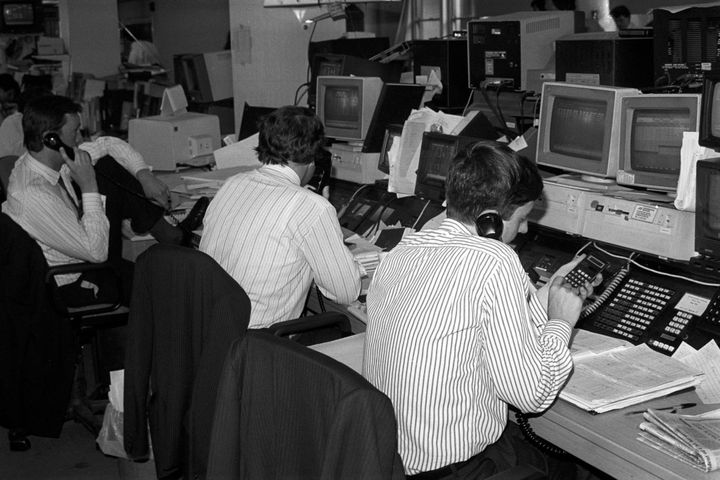 Dealers at their trading screens in London, as prices plunge following the Friday 13th crash