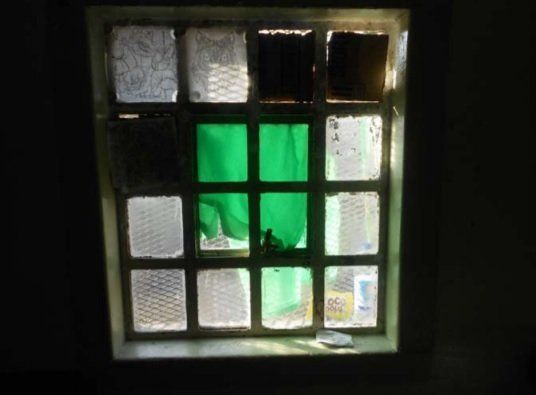 A broken window at HMP Swinfen Hall, in Staffordshire