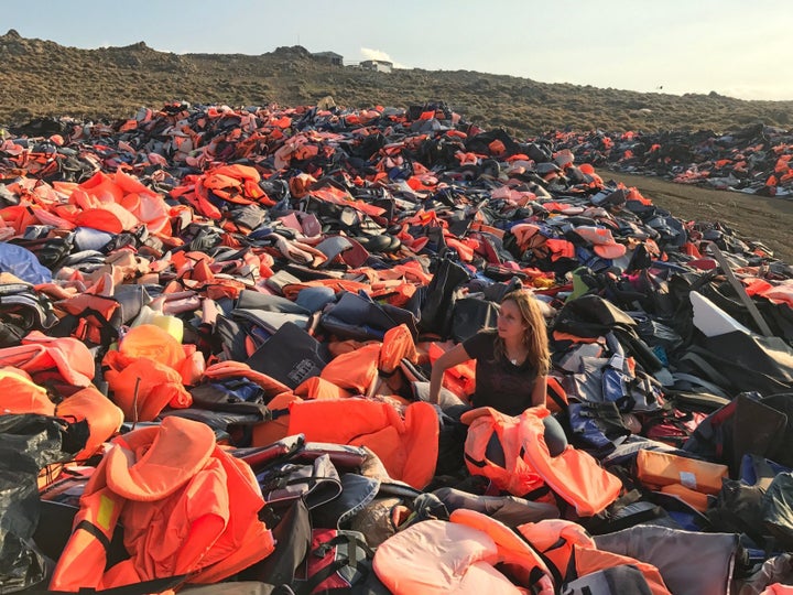 Longobardi sorts through the vast piles of plastic safety gear along the shores of Lesvos.