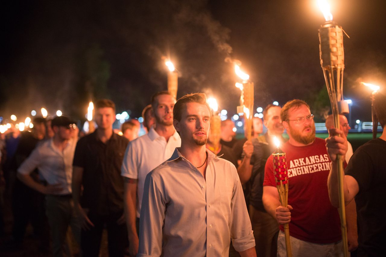 White supremacists march with tiki torches through the University of Virginia campus the night before the "Unite the Right" rally in Charlottesville.