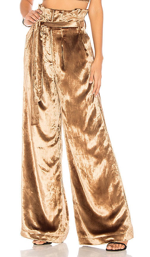 <a href="http://www.revolve.com/chrissy-teigen-x-revolve-thai-tea-pant/dp/CTEI-WP3/?d=Womens&page=1&lc=19&itrownum=7&itcurrpage=1&itview=01&plpSrc=%2Fr%2FBrands.jsp%3FaliasURL%3Dchrissy-teigen%2Fbr%2F11bc37%26%26s%3Db%26c%3DChrissy%2BTeigen%26sortBy%3Dprice" target="_blank" role="link" class=" js-entry-link cet-external-link" data-vars-item-name="Chrissy Teigen x Revolve Thai Tea Pant" data-vars-item-type="text" data-vars-unit-name="59dfd1fbe4b0a52aca16a573" data-vars-unit-type="buzz_body" data-vars-target-content-id="http://www.revolve.com/chrissy-teigen-x-revolve-thai-tea-pant/dp/CTEI-WP3/?d=Womens&page=1&lc=19&itrownum=7&itcurrpage=1&itview=01&plpSrc=%2Fr%2FBrands.jsp%3FaliasURL%3Dchrissy-teigen%2Fbr%2F11bc37%26%26s%3Db%26c%3DChrissy%2BTeigen%26sortBy%3Dprice" data-vars-target-content-type="url" data-vars-type="web_external_link" data-vars-subunit-name="article_body" data-vars-subunit-type="component" data-vars-position-in-subunit="12">Chrissy Teigen x Revolve Thai Tea Pant</a>, $188.