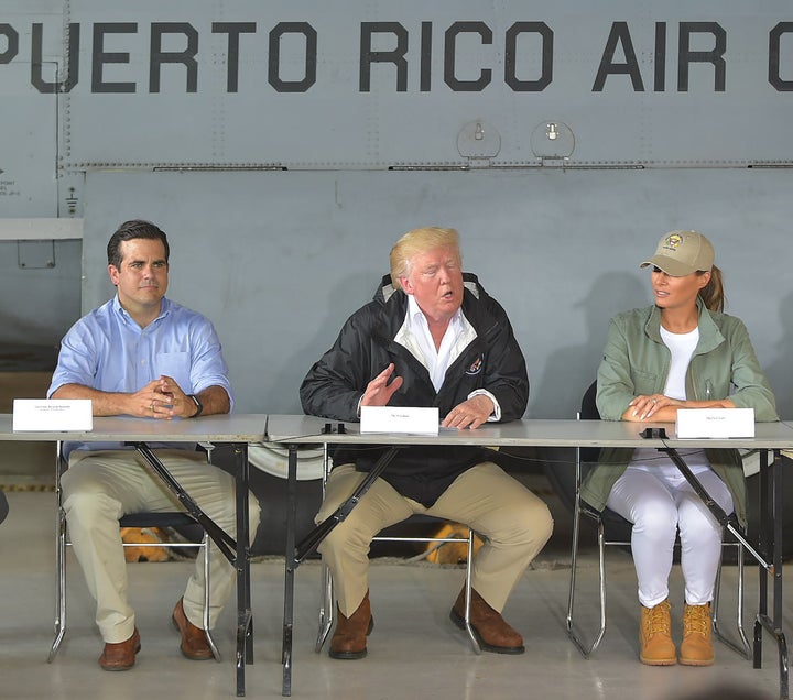 President Donald Trump, first lady Melania Trump and Puerto Rico Gov. Ricardo Rossello at a press briefing in Puerto Rico on Oct. 3.