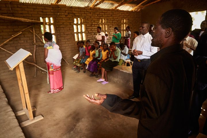 Jennifer sings as the rest of the congregation prays during a Sunday morning service, Well of Life Church, Luchenza, southern Malawi, 2017.