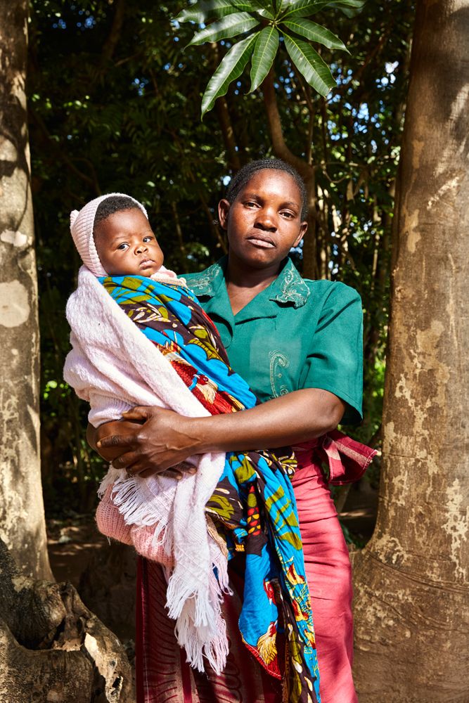 Mother and child pose outside Well of Life Church, Luchenza, southern Malawi, 2017. The little girl was just welcomed as the newest, and youngest, member of the congregation. 