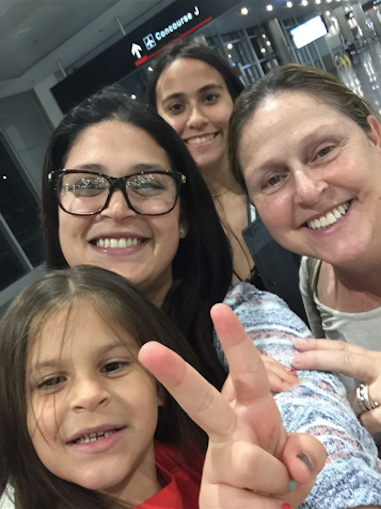 Deborah Drahus Capo (right) with (from bottom) her granddaughter, daughter and niece at the airport in San Juan, Puerto Rico.