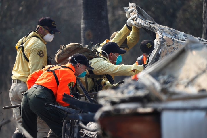 Search and Rescue teams search for two missing people amongst ruins at Journey's End Mobile Home Park destroyed by the Tubbs