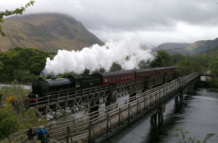 The Jacobite steam train crosses the river Lochy as it departs Fort William, Scotland. The train was used to depict the Hogwarts Express in the "Harry Potter" films.