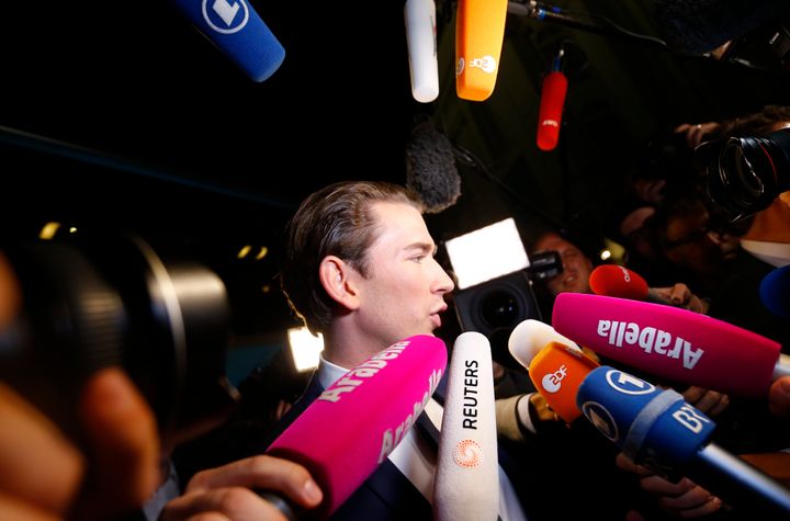 Kurz gets mobbed by reporters as he arrives to give his first TV statements after the election
