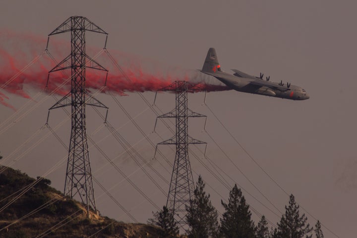 A National Guard air tanker drops fire retardant during the Oakmont Fire on October 15, 2017 near Santa Rosa, California. (Ph
