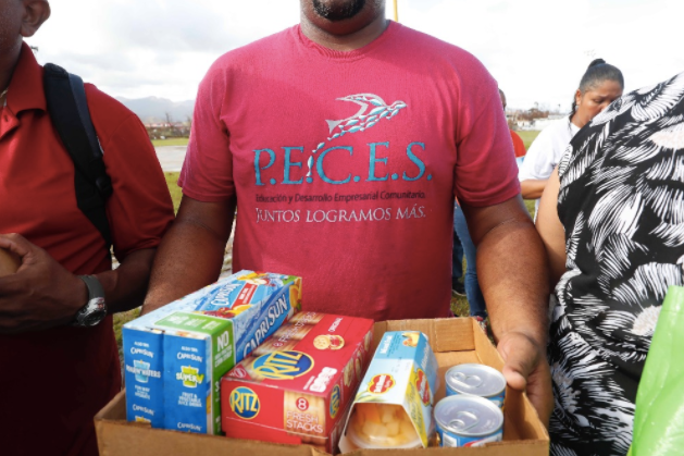 Community members with nonprofit P.E.C.E.S. in Humacao, Puerto Rico, help provide aid after the hurricane -- and look toward