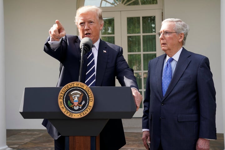 President Donald Trump speaks to the media with Senate Majority Leader Mitch McConnell at his side in the White House's Rose