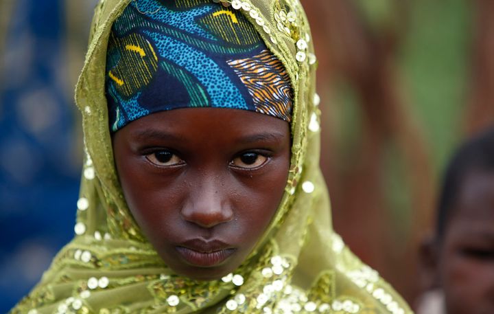A girl from the Peul tribe stands in a village outside Bambari, Central African Republic.