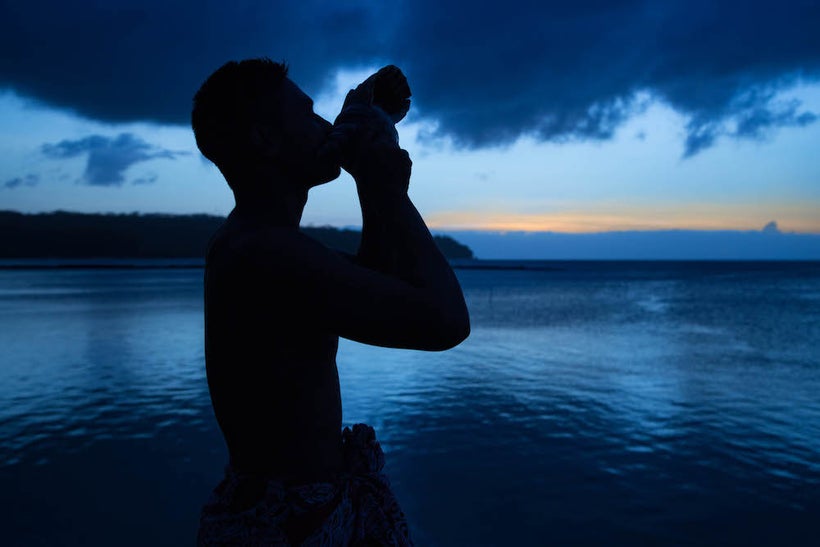A local Samoan praises the end of the day by playing a conch shell at <a rel="nofollow" href="http://www.lelagoto.ws/" target