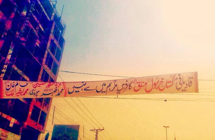 <p>Oct 14, 2017: Prominently displayed on a highway across a major hospital in Pakistan’s second largest city of Lahore, this banner reads: “Qadianis (pejorative for Ahmadi Muslims) are blasphemers, hypocrites, and infidels and do not belong here.” In this very part of Lahore, almost a hundred Ahmadi Muslims were gunned down by the Taiban in 2010.</p>