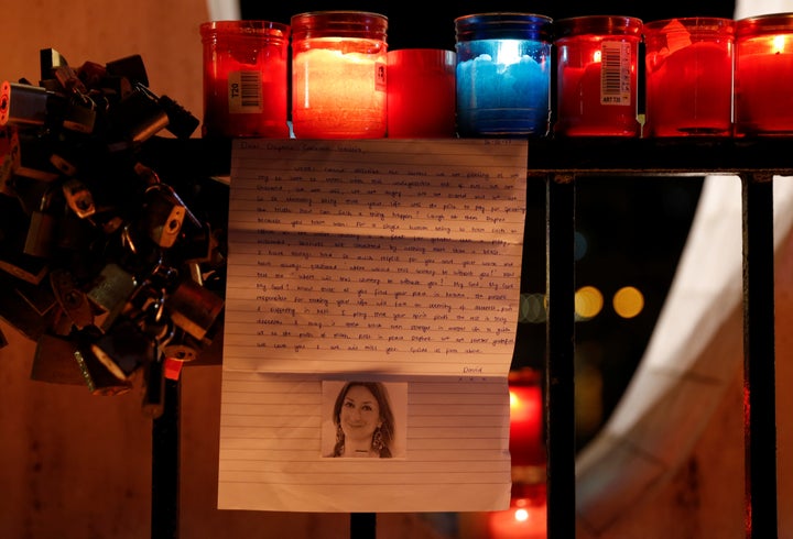 A tribute to Caruana Galizia at the Love monument during a candlelit vigil in St Julian's, Malta 