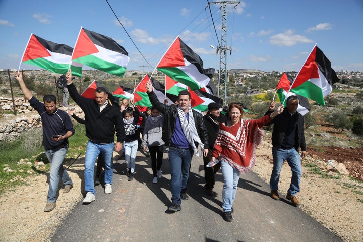 Palestinians stage a protest against Israel's separation wall.