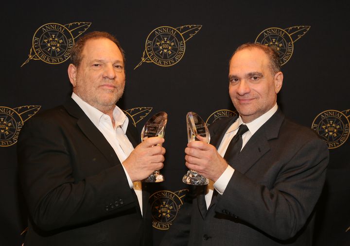 Harvey and Bob Weinstein pose with the Motion Picture Showmanship Award backstage at The Beverly Hilton hotel on Feb. 20, 2015.