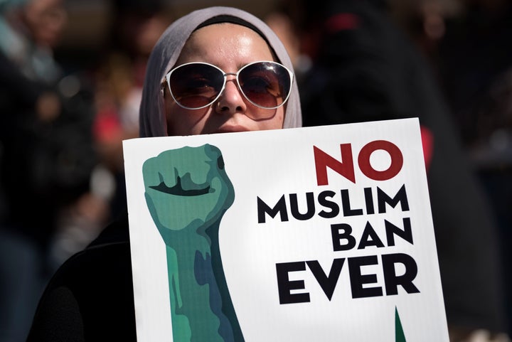 An activist in Los Angeles holds a sign on Oct. 15 during a protest against President Donald Trump's travel ban. 