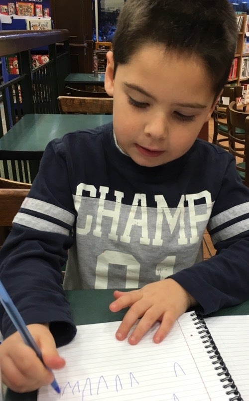 My son practicing his letters last year as part of his homework. We had to squeeze it in between a dentist appointment and ho