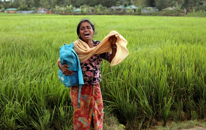 Taslima, a 20-year-old Rohingya refugee, cries on Oct. 16 after her father died while crossing the Myanmar-Bangladesh border.