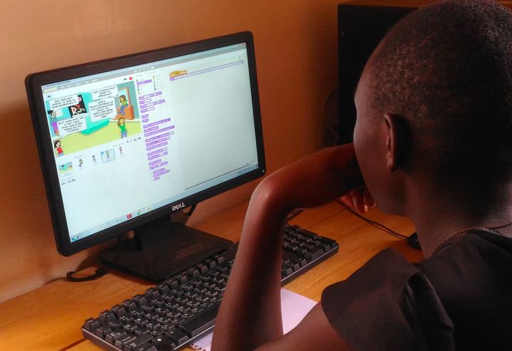 <p><strong>Rosemary using ‘Scratch’ at Theirworld Code Club, Women in Technology Uganda. </strong></p>