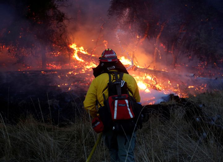 Firefighters battle a wildfire near Santa Rosa, California, U.S., October 14, 2017. 