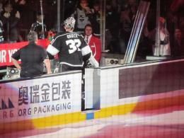 <p> Los Angeles Kings player Jonathan Quick exits the ice near an advertisement for China’s O.R.G. Packaging, which became a sponsor of the NHL last year. Image: Flickr user Dinur </p>