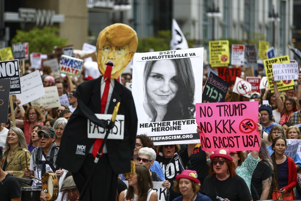 A Chicago demonstrator holds a banner in memory of Heather Heyer, who was killed Aug. 12 by a driver in Charlottesville, Virginia, during a protest against racism and hate on Aug. 27.