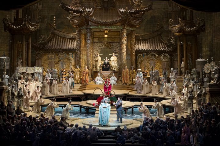 <p>Oksana Dyka and Aleksandrs Antonenko, foreground, surrounded by the Met Chorus in Puccini’s <em>Turandot</em>.</p>