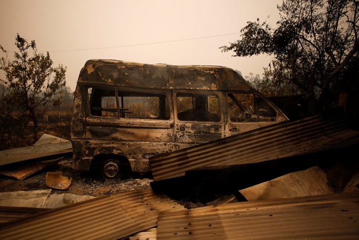 A burned-out vehicle was left behind by a forest fire near Vale do Couco, Portugal, on Oct. 16, 2017.