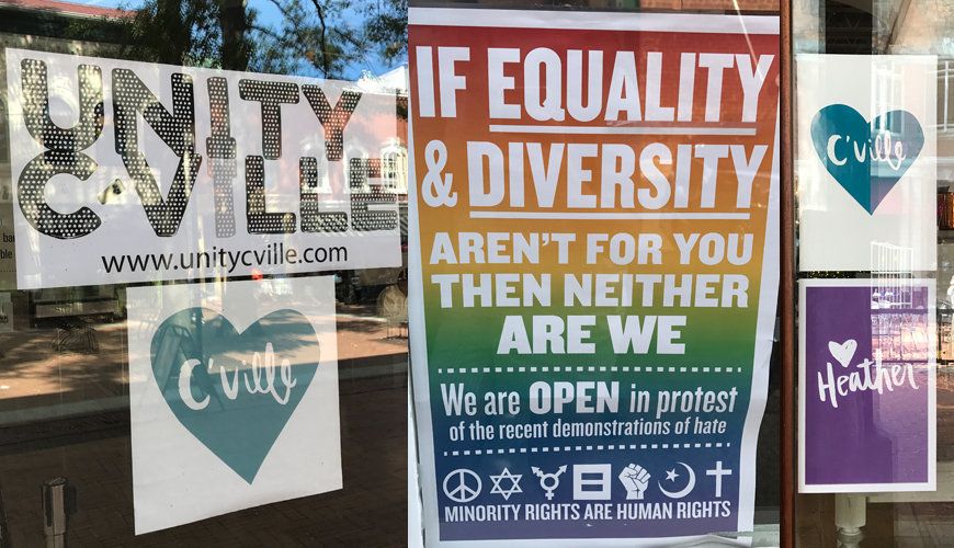 Signs posted throughout Charlottesville's downtown area in September, a month after the violence of the "Unite the Right" rally.