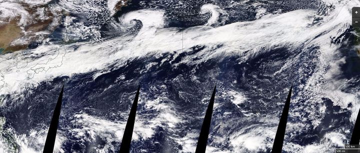 The composite image above, released by NASA, shows a large atmospheric river stretching from China on the left to the coast of North America on the right.