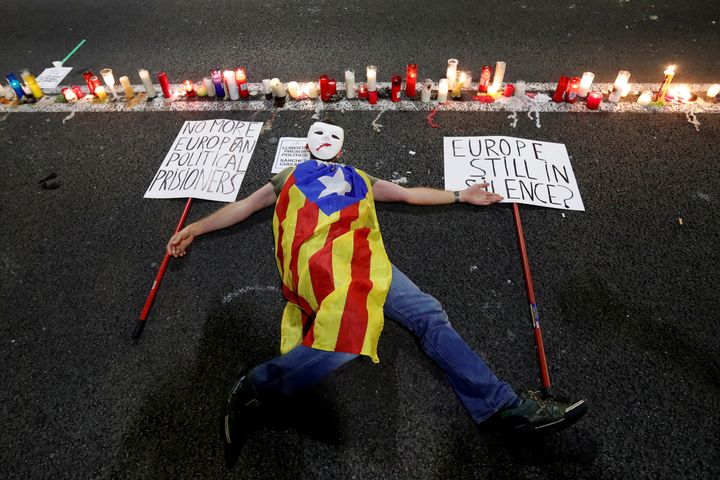 A man protests over the imprisonment of leaders of two of the largest Catalan separatist organisations