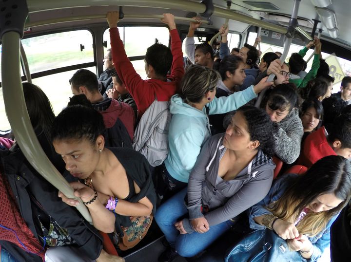 Passengers are seen on the Transmilenio system bus during rush hour in Bogota, Colombia.