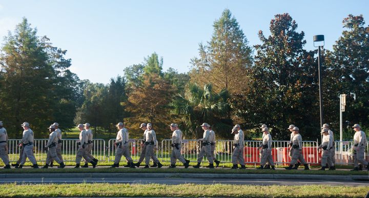 Florida State Troopers walk from their hotel to the University of Florida Campus before a speaking event by Richard Spencer on Thursday October 19 2017 in Gainesville