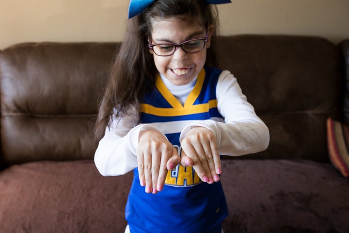 Gianna was diagnosed with 22q11.2 deletion syndrome in utero. Although she has had 26 surgeries, she is still able to participate in her town's general cheering squad.