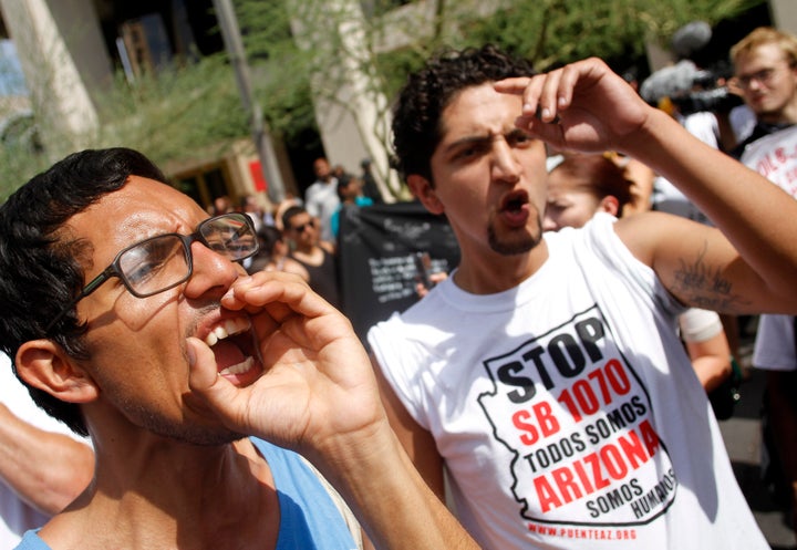 Demonstrators protest against Arizona's controversial Senate Bill 1070 immigration law outside Sheriff Joe Arpaio's office in Phoenix on July 29, 2010.