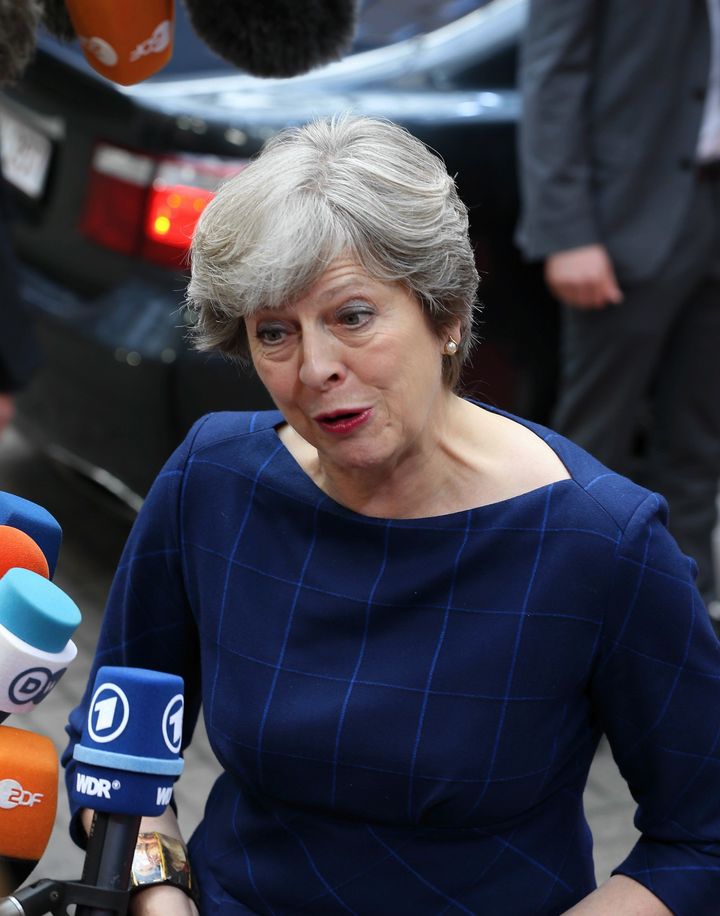 Theresa May speaks to reporters at the summit in Brussels 