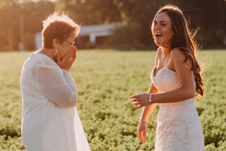 Seeing her granddaughter in the dress for the first time. 