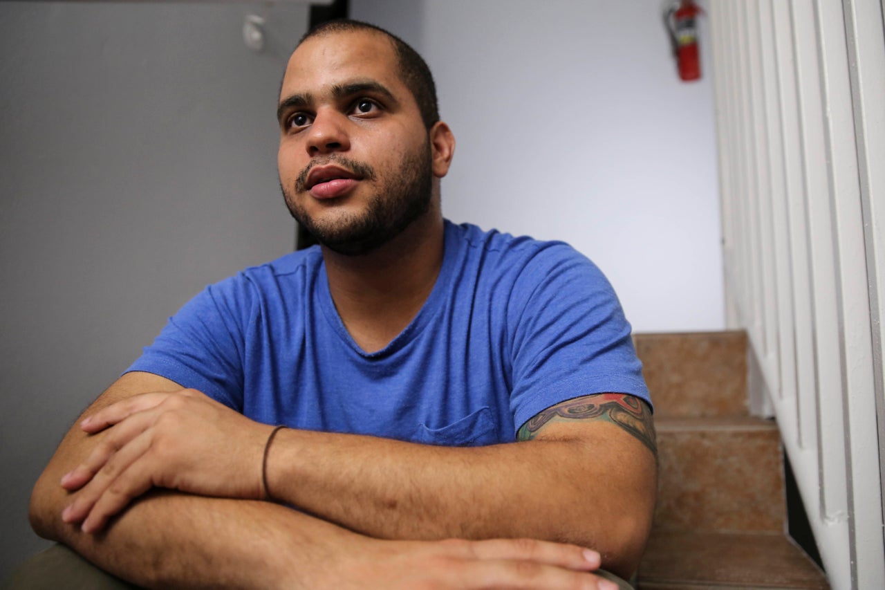Christian Romero talks to HuffPost from the stairwell of his apartment complex on Oct. 14, 2017 in Carolina, Puerto Rico.