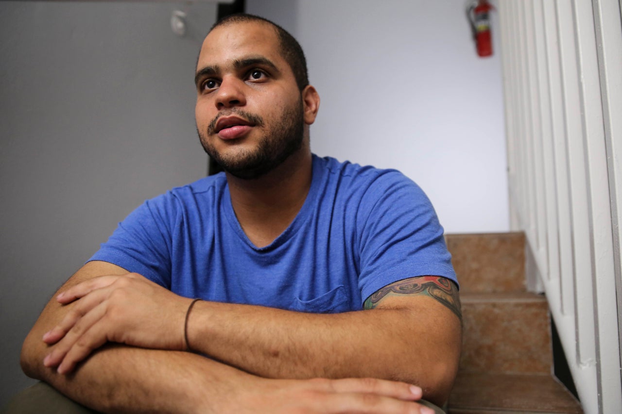 Christian Romero talks to HuffPost from the stairwell of his apartment complex on Oct. 14, 2017 in Carolina, Puerto Rico. 