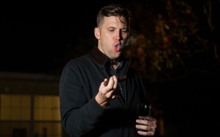 Richard Spencer tries to act cool while smoking a cigar.