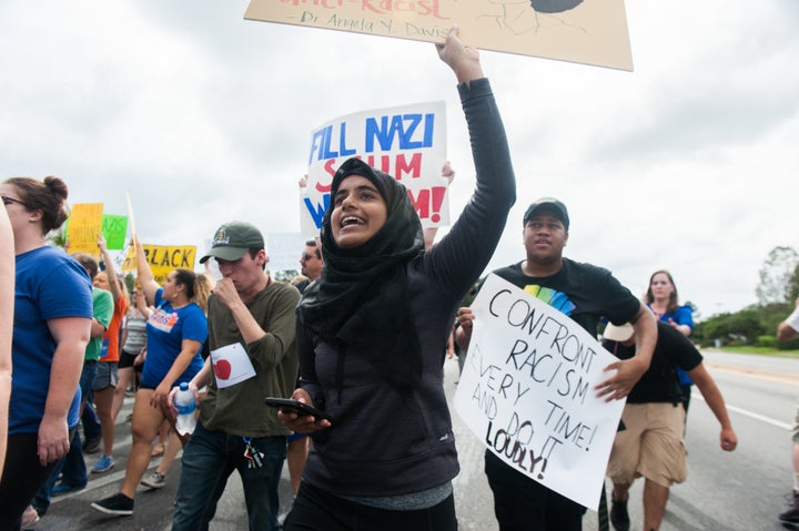 Nushrat Nur, a student at the University of Florida in Gainesville, marches down 34th street.