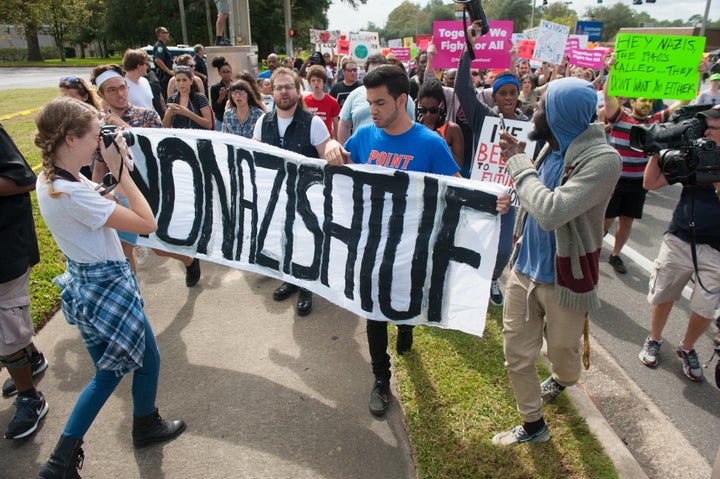 People march down 34th street to the entrance to the University of Florida.