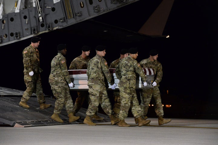 A U.S. Army carry team transfers the remains of Army Staff Sgt. Dustin Wright of Lyons, Georgia, at Dover Air Force Base in D