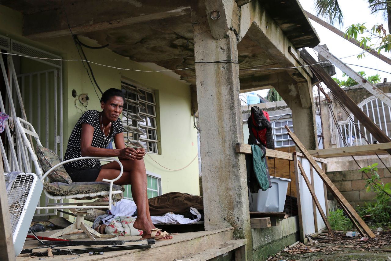 Juana Ferrera sits on the porch of her home in Valle Hill, Canóvanas, Puerto Rico.