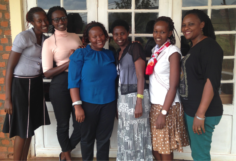 <em>The Komera staff outside of their office in Rwinkwavu</em>