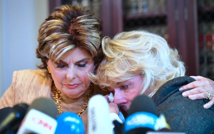 Heather Kerr, right, reacts after alleging in a news conference that she was sexually harassed by film producer Harvey Weinstein. Attorney Gloria Allred is at her side.