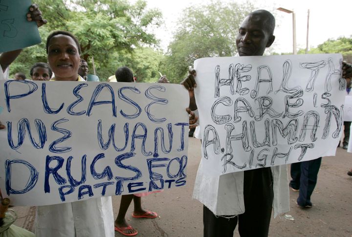Zimbabwean doctors and nurses hold placards during a demonstration over the deteriorating health system, outside Parirenyatwa group of hospitals in Harare November 18, 2008