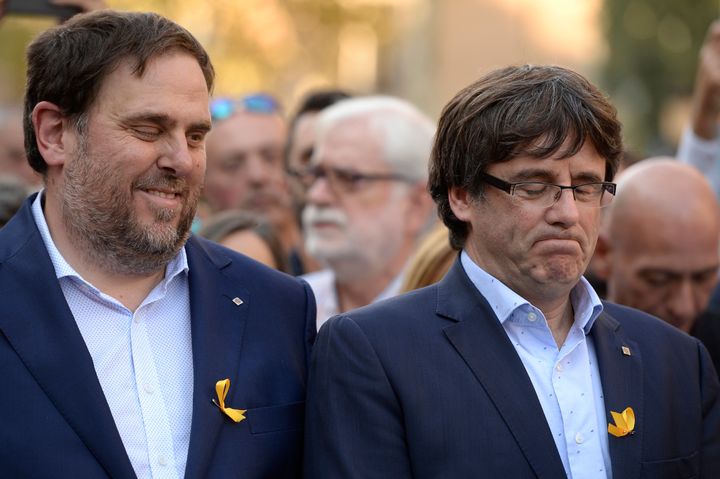 Catalan regional president Carles Puigdemont (R) and Catalan regional vice-president and chief of Economy and Finance Oriol Junqueras attend the demonstration 